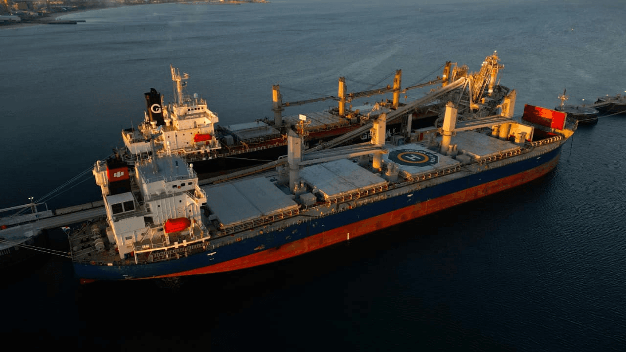 Aerial view of a cargo ship docked at port